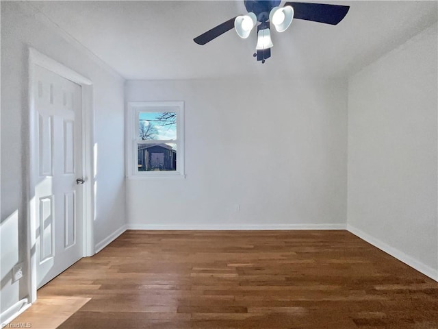 spare room featuring ceiling fan and hardwood / wood-style floors