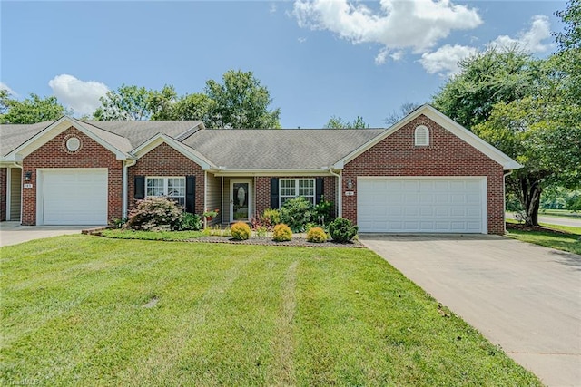 101 Kingston Ln, Graham, NC 27253 - ranch-style home featuring an attached garage, brick siding, a front lawn, and driveway