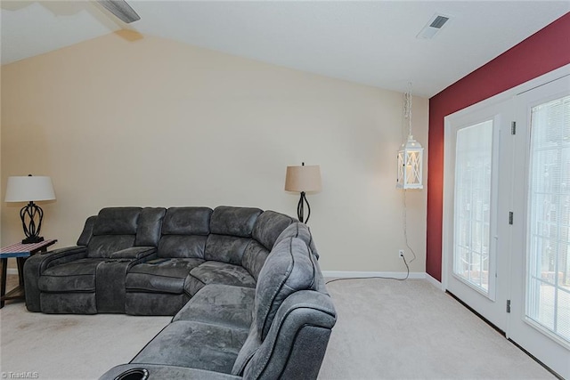 101 Kingston Ln, Graham, NC 27253 - carpeted living area with baseboards and vaulted ceiling