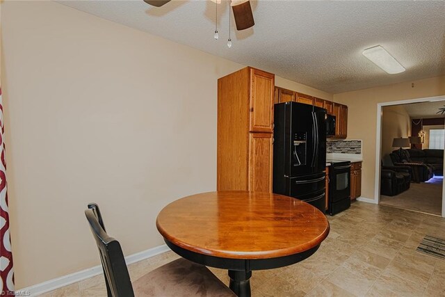 101 Kingston Ln, Graham, NC 27253 - dining room with a ceiling fan and a textured ceiling