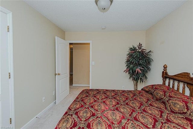 101 Kingston Ln, Graham, NC 27253 - bedroom featuring light colored carpet and a textured ceiling