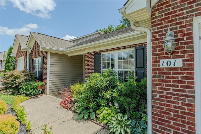 101 Kingston Ln, Graham, NC 27253 - view of side of home featuring brick siding and a shingled roof