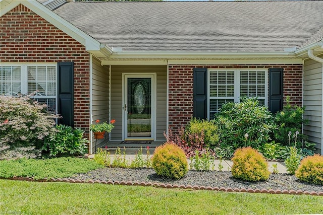 101 Kingston Ln, Graham, NC 27253 - view of exterior entry featuring brick siding and roof with shingles