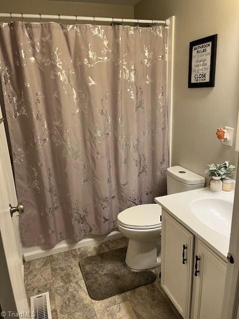 bathroom with shower / bathtub combination with curtain, visible vents, vanity, and toilet