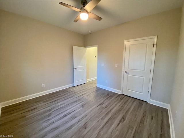 unfurnished bedroom with ceiling fan and light hardwood / wood-style flooring