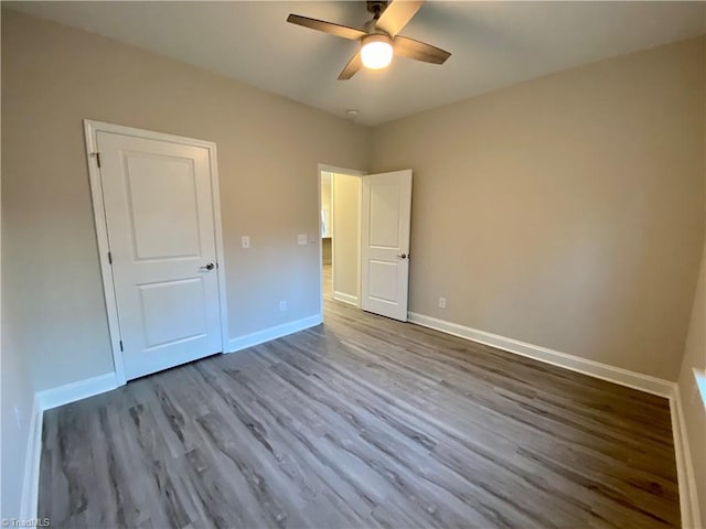 unfurnished bedroom featuring ceiling fan and light hardwood / wood-style floors