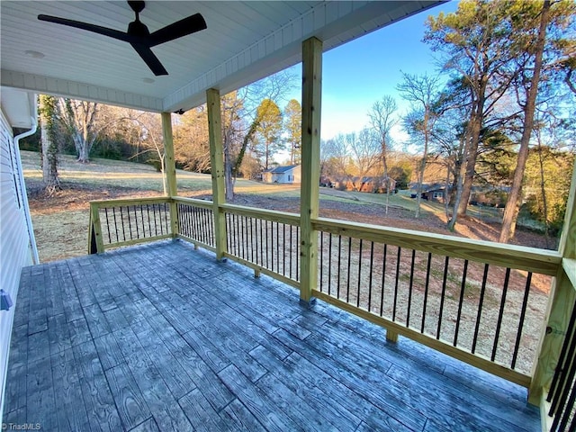 wooden terrace featuring ceiling fan