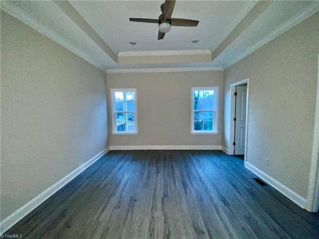 empty room with dark hardwood / wood-style flooring, plenty of natural light, and ceiling fan