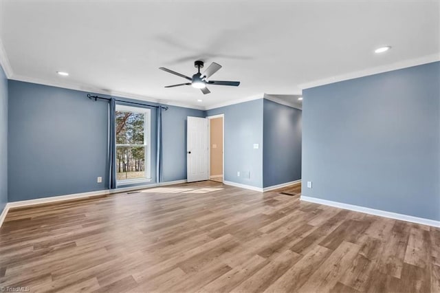 unfurnished room featuring recessed lighting, ornamental molding, ceiling fan, wood finished floors, and baseboards