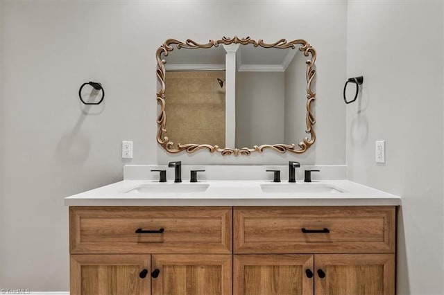 full bathroom featuring double vanity, crown molding, and a sink