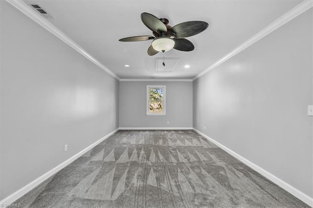 unfurnished room with carpet, visible vents, crown molding, and baseboards