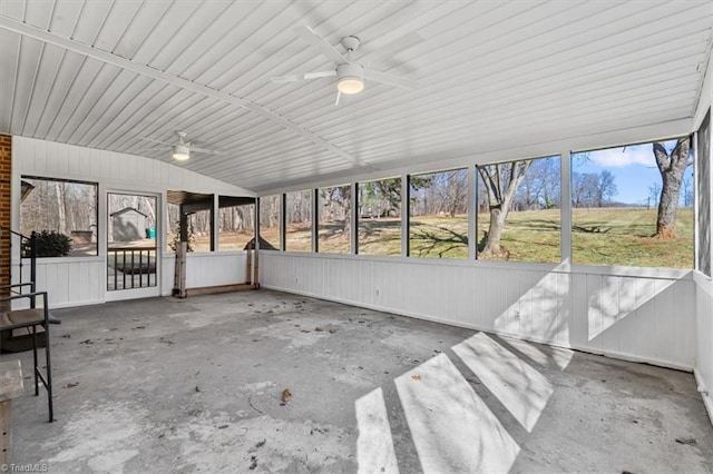 unfurnished sunroom featuring ceiling fan