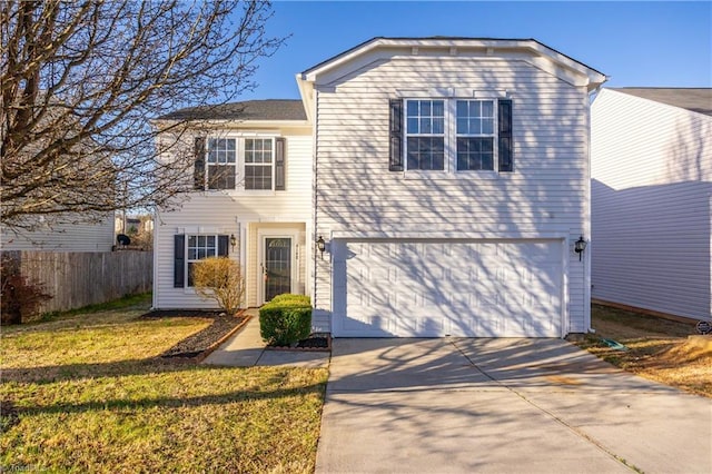 traditional-style home featuring concrete driveway, an attached garage, fence, and a front yard