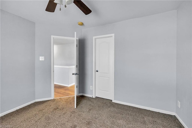 unfurnished bedroom featuring ceiling fan, baseboards, and carpet floors