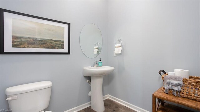 3810 Colt Ct, Trinity, NC 27370 - half bathroom featuring wood finished floors, baseboards, and toilet