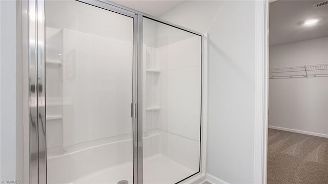 3810 Colt Ct, Trinity, NC 27370 - full bath featuring a shower stall, a spacious closet, baseboards, and visible vents