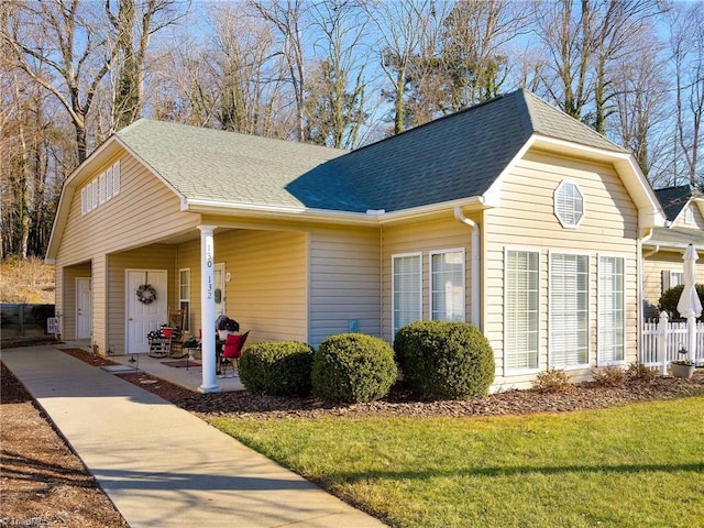 view of front of home with a garage and a front yard