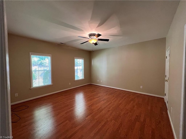 unfurnished room featuring ceiling fan and hardwood / wood-style floors