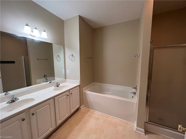 bathroom featuring vanity and shower with separate bathtub