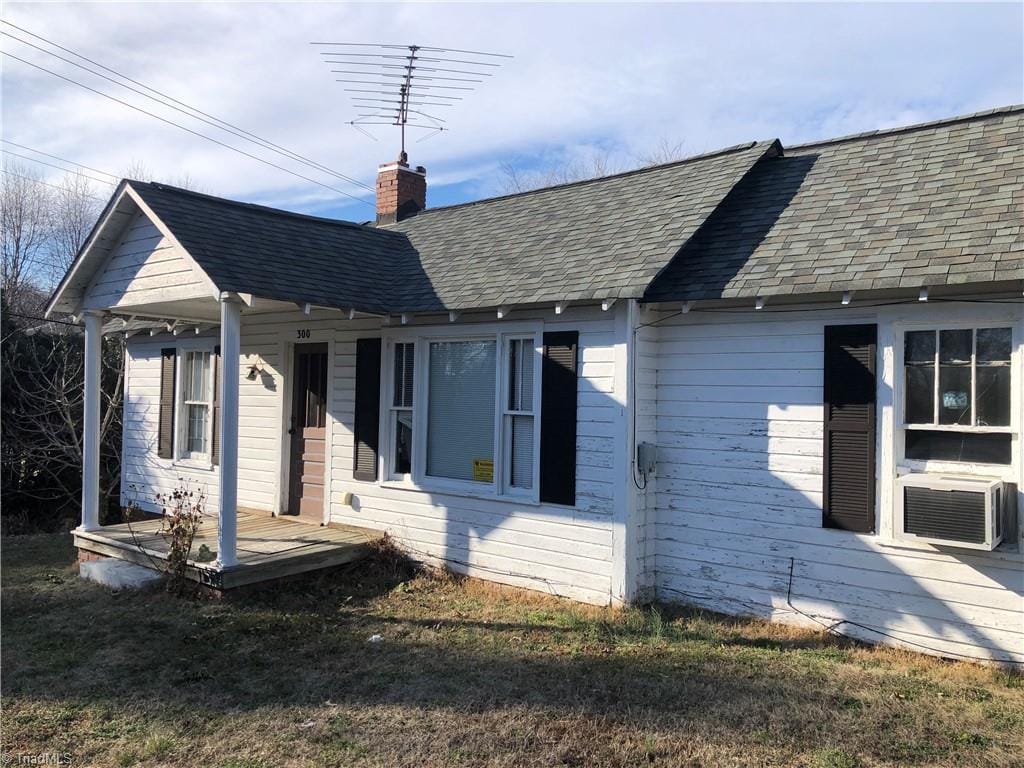 view of side of home featuring cooling unit