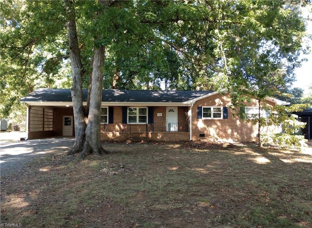 ranch-style house with a porch and a carport