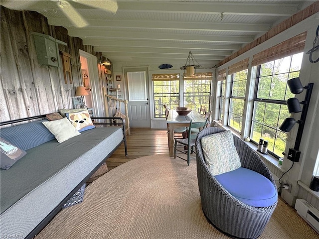 sunroom with a baseboard radiator and beam ceiling