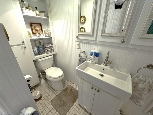 bathroom with tile patterned floors, toilet, and vanity