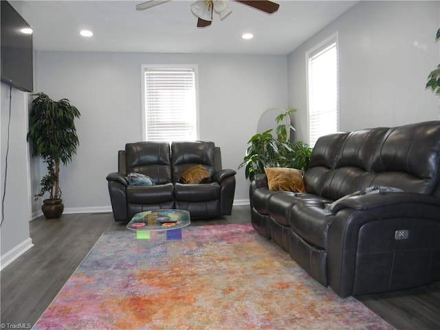 living room featuring plenty of natural light, dark hardwood / wood-style floors, and ceiling fan