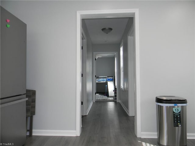 hall with dark hardwood / wood-style flooring