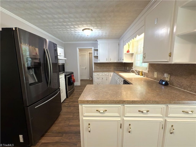 kitchen featuring open shelves, a sink, dark wood-style floors, a peninsula, and stainless steel appliances