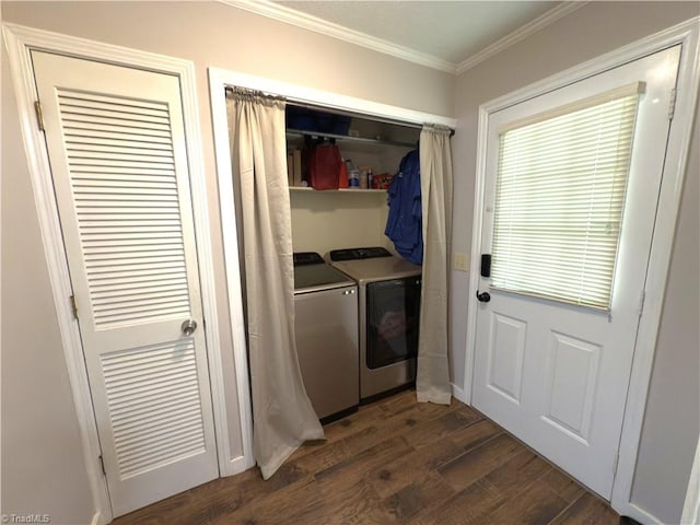 laundry room with dark wood-style flooring, separate washer and dryer, laundry area, and crown molding