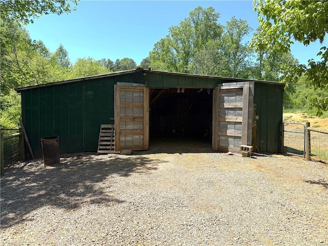 view of outdoor structure featuring an outdoor structure and fence