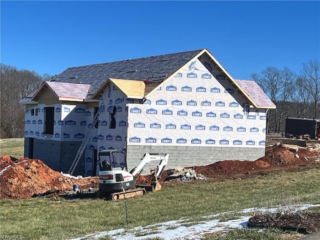 view of side of home featuring a yard