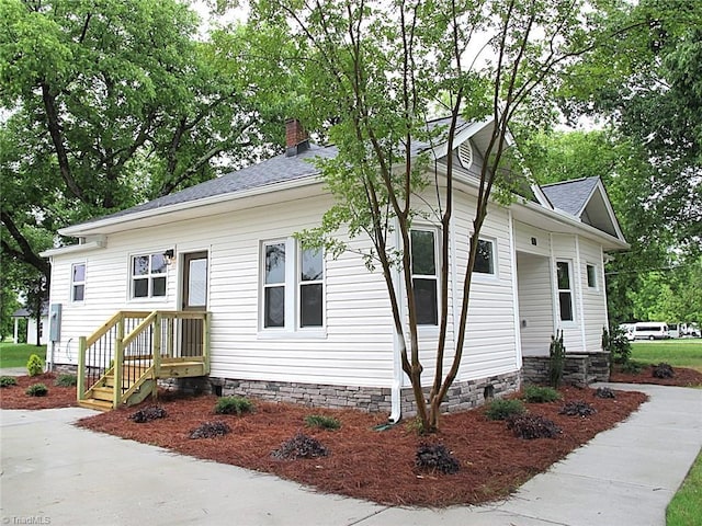 812 Midway School Rd, Winston-Salem, NC 27107 - view of front of house featuring a chimney and roof with shingles
