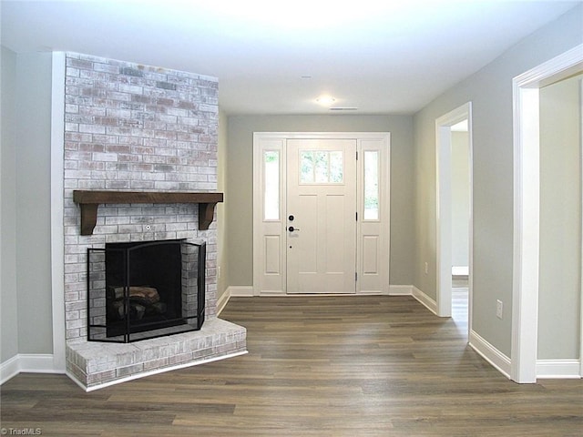 812 Midway School Rd, Winston-Salem, NC 27107 - entrance foyer with baseboards, wood finished floors, and a fireplace