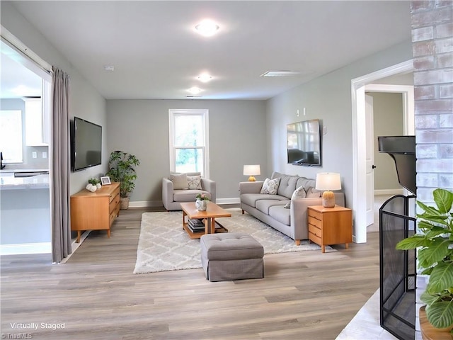 812 Midway School Rd, Winston-Salem, NC 27107 - living area featuring light wood-style flooring and baseboards