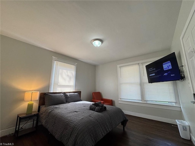 bedroom featuring dark hardwood / wood-style flooring