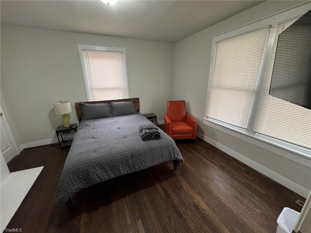 bedroom featuring dark hardwood / wood-style flooring