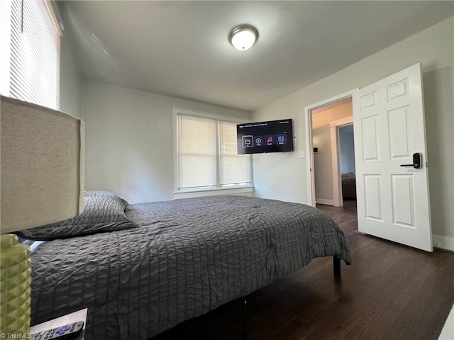 bedroom featuring dark hardwood / wood-style flooring