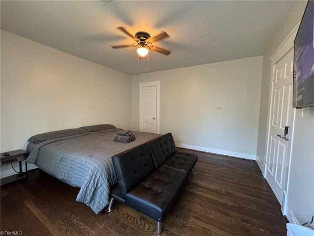 bedroom featuring dark hardwood / wood-style flooring and ceiling fan