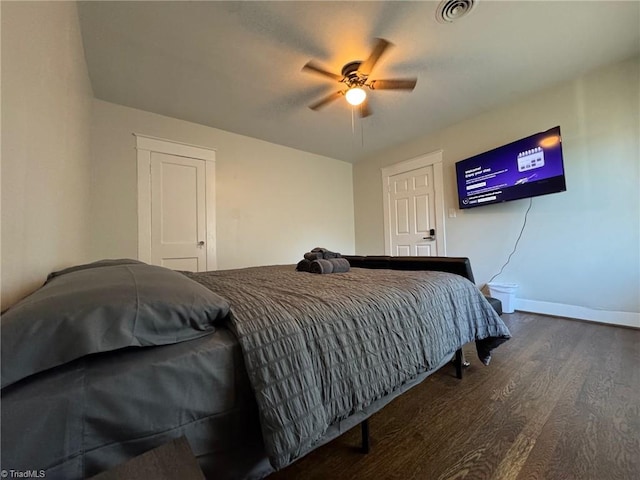 bedroom featuring dark hardwood / wood-style flooring and ceiling fan