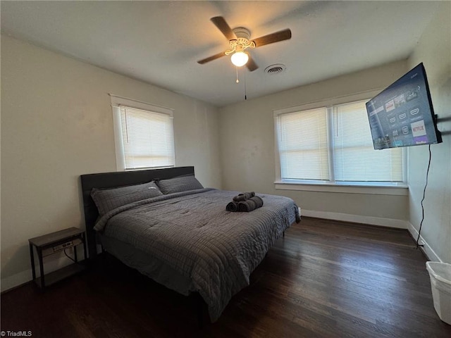 bedroom featuring dark wood-type flooring and ceiling fan