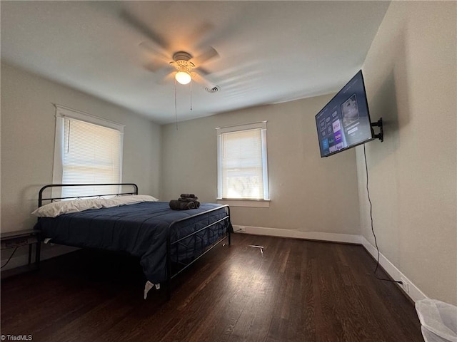 bedroom featuring ceiling fan and dark hardwood / wood-style floors