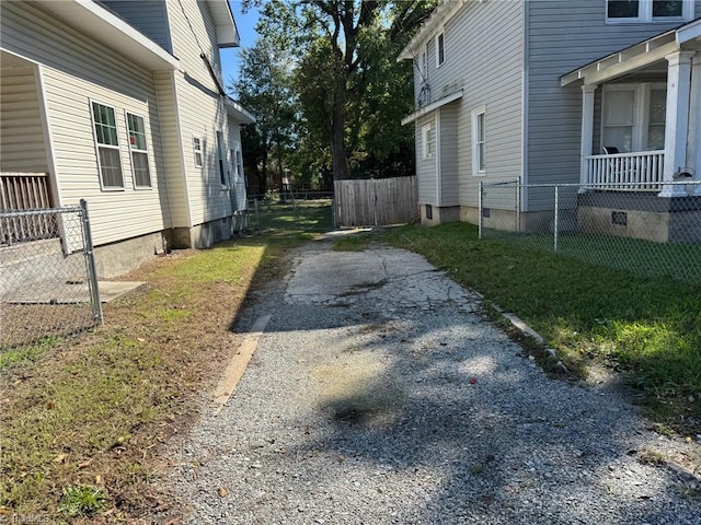 view of side of home with a lawn