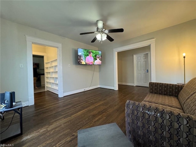 living room with dark hardwood / wood-style floors and ceiling fan