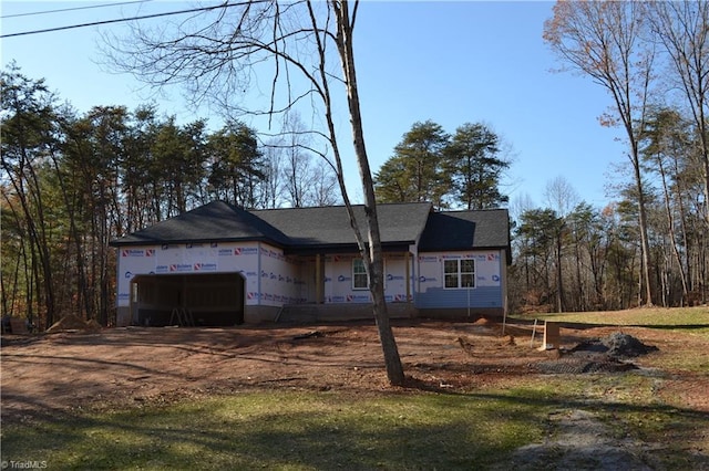 unfinished property with a garage