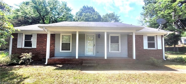 305 Corliss St, Greensboro, NC 27406 - view of front facade with covered porch and brick siding