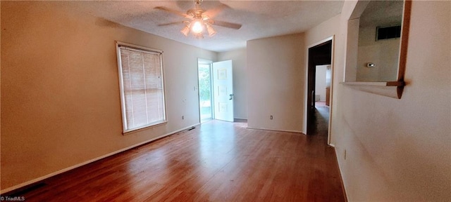 305 Corliss St, Greensboro, NC 27406 - spare room featuring ceiling fan, wood finished floors, and baseboards