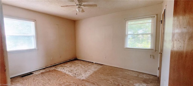 305 Corliss St, Greensboro, NC 27406 - empty room with healthy amount of natural light, a ceiling fan, and a textured ceiling