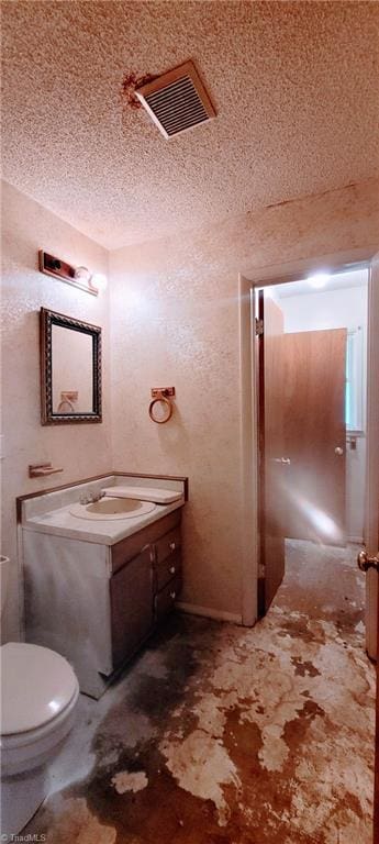 305 Corliss St, Greensboro, NC 27406 - bathroom featuring a textured ceiling, vanity, toilet, and concrete flooring